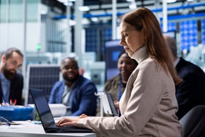 photovoltaics-factory-management-team-analyzing-data-using-laptop